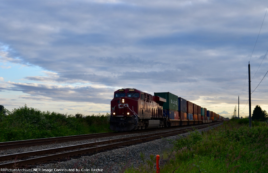 With over 11,000 ft, CP 148, priority stack train led by CP 8955 passes through Colebrook enroute to Bensenville, Ill.